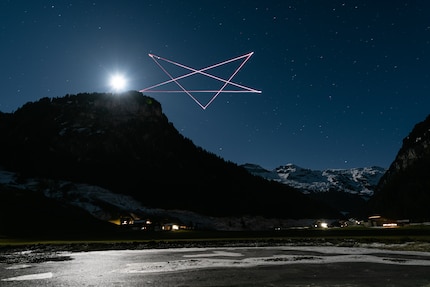 Photo 1: the drone draws a star at a height of 60 metres above the ground. ISO 100 f4 50 second exposure.