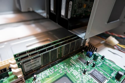 The Motherboard and RAM slot in exactly next to the HDD cage.