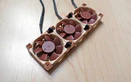 Three Noctua NF-A4x10 FLXs, all holding together thanks to cable ties.