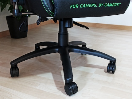 A metal base and classic office chair wheels.