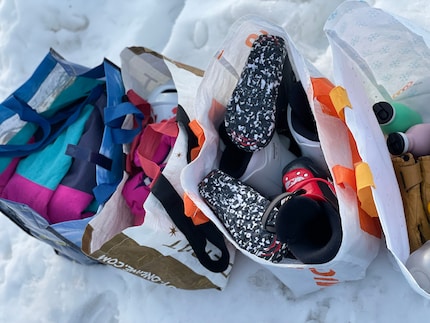 We pack four bags for two hours of fun on the slopes. At least.