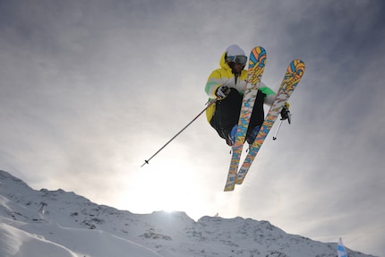 Freestylers fly over the slopes on wide skis.