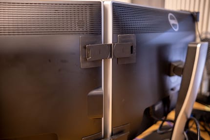 One of the two adapters fixed to the monitors.
