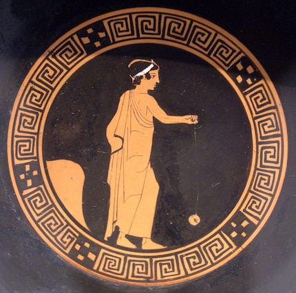 A Greek painting of a boy playing with a yo-yo.