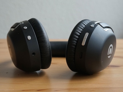 The silver buttons stick out a bit and are slightly wobbly.