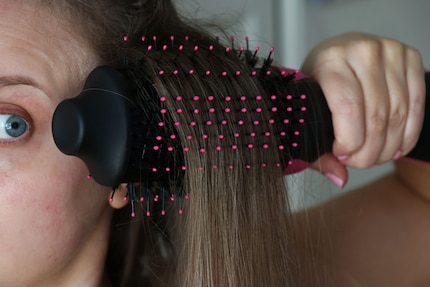 For volume at the roots, I place the brush under the hairline.
