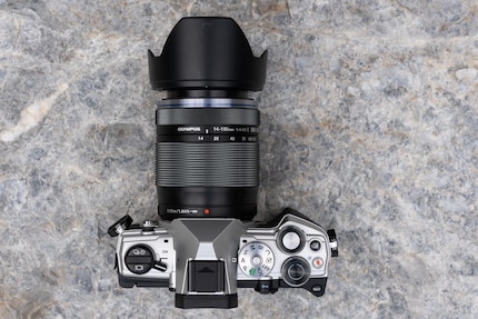 The OM System OM-5 has both dials on top of the camera. I can reach them easily, and they feel good. Having the On button on the left, on the other hand, is impractical, in my opinion.