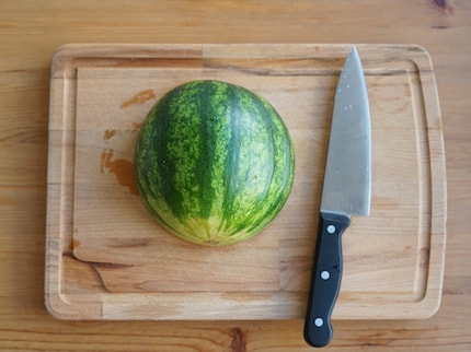 A big knife works best.