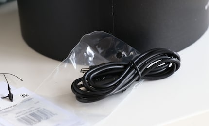 A charging cable is included.