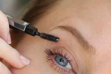 Carefully brush the smudge off the skin.