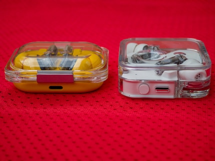 Both have a USB-C slot, but only the Ear allows for wireless charging.