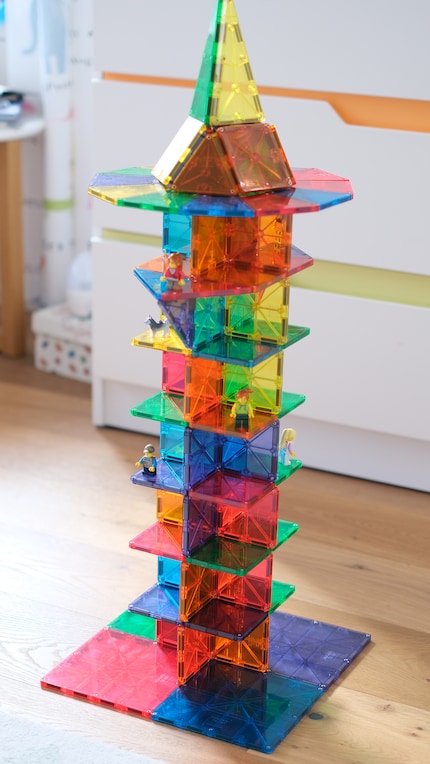 The ultimate feeling: a tower made of MAGNA-TILES. My daughter recruited the LEGO residents.