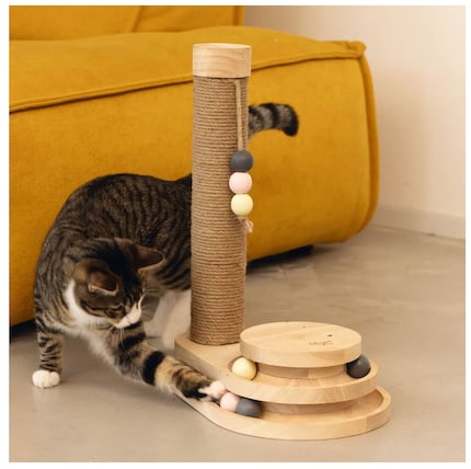 The cat toy in action is intended to convey the size of the product and its use.