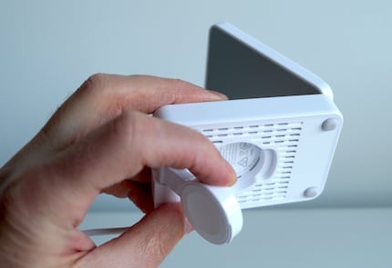 A charging spot for the watch can be folded out of the base if required.