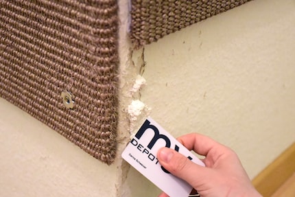 The old Depot loyalty card serves as a makeshift scraper.
