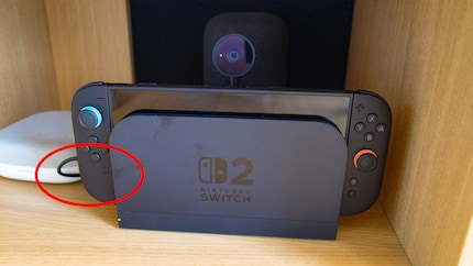 It’s practical that I can keep the camera plugged in and remove my Switch from the dock without fumbling about. The USB-A slots are located at the back of the dock at the point marked in red.