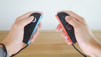 I like to play in two-handed mode with the Joy-Cons and the wrist straps.