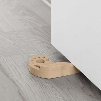This beige snail will put the brakes on a rapidly closing door.