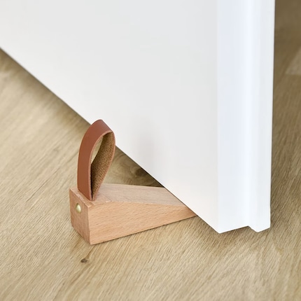This wedge holds doors securely and stylishly in place.