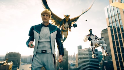 They appear pretty much out of nowhere and are never explained: Guy Gardner, a Green Lantern, Hawkgirl and Mr Terrific – or something.