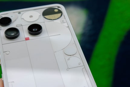 The Glyph button is the higher of the two circles on the right-hand side of the back panel.