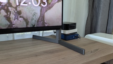 There is about seven centimetres of space between the bottom edge of the TV and the stand. That should be enough for most soundbars.