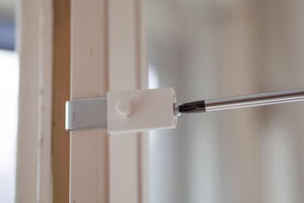 Step one: tighten the bracket with a screwdriver.