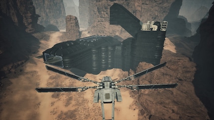 The huge wings of a fighter ornithopter peek out on the left. They even protrude through the wall.