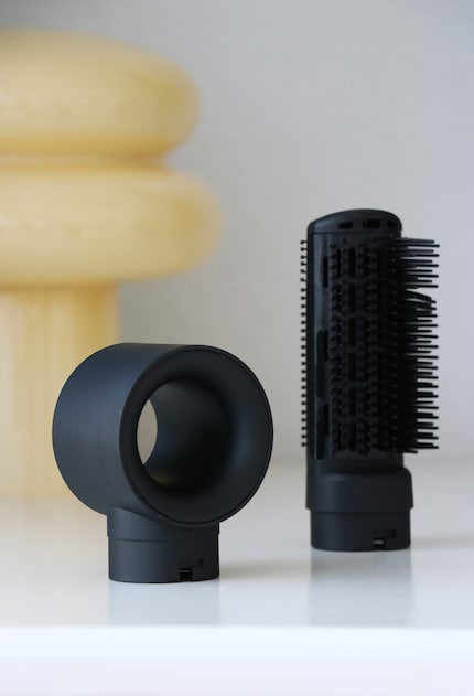 The drying attachment on the left, the paddle brush on the right.