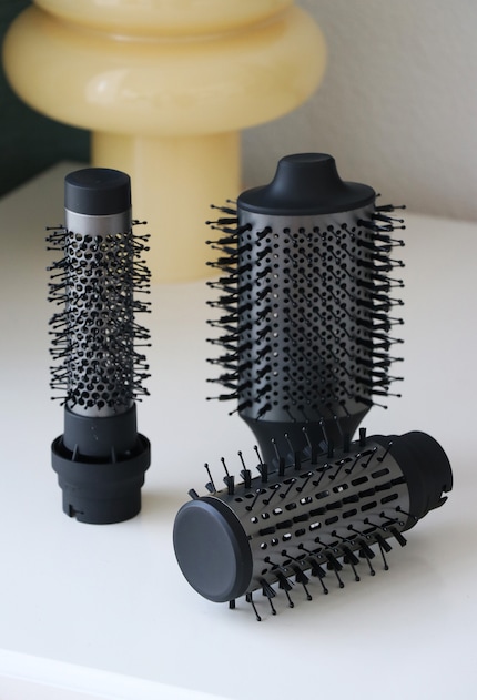 The two round brushes and the oval attachment.