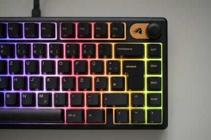 The keyboard flashes and lights up, but the light coming through the lettering is very faint.